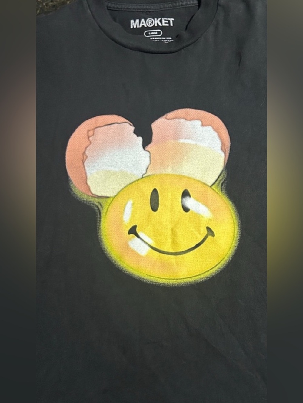 Market The Smiley co. black T-shirt with cracked egg and smile